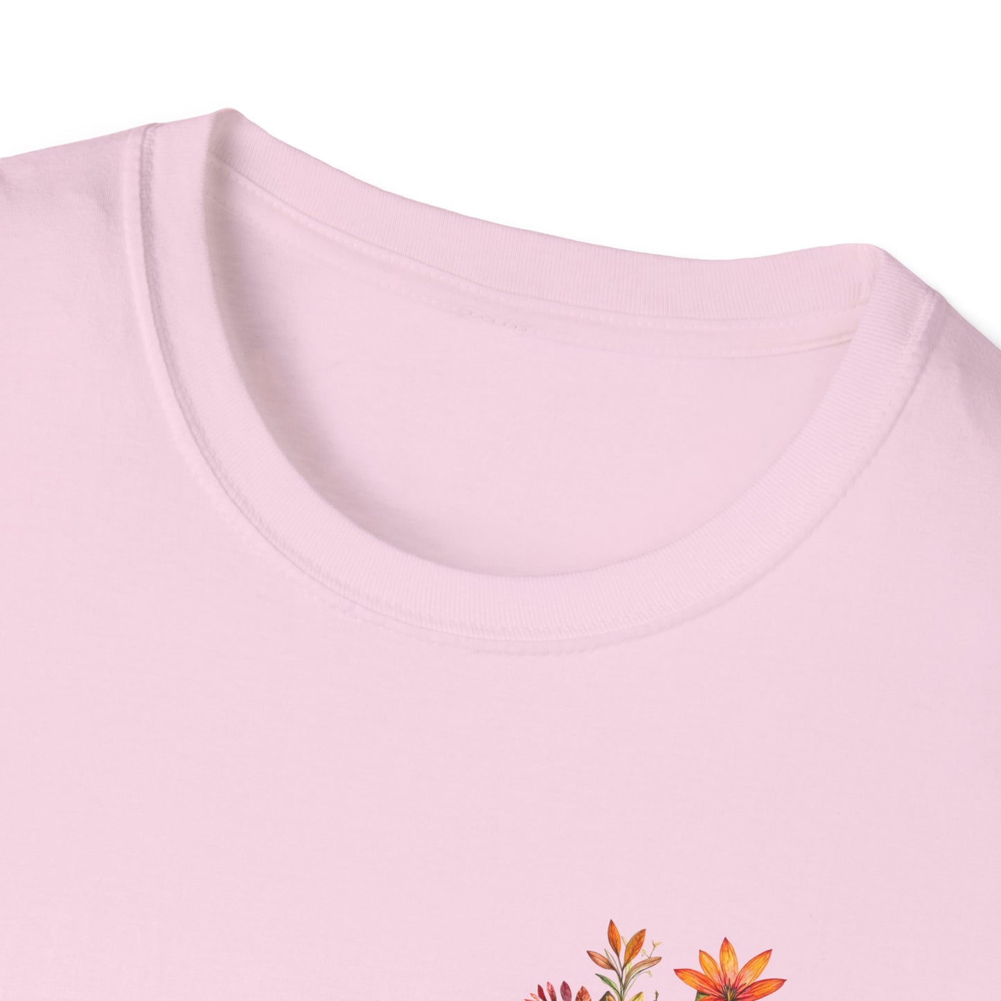 Light pink floral cross t-shirt featuring colorful floral designs on the chest