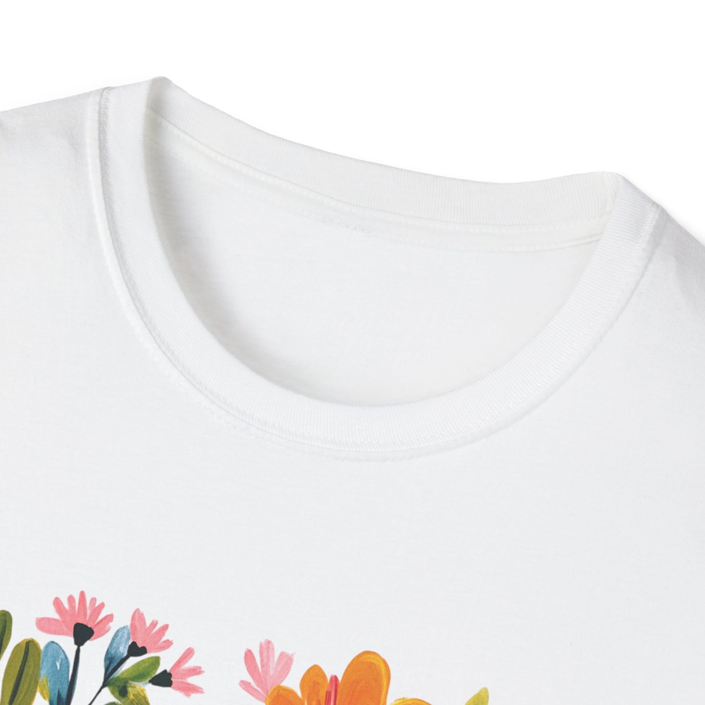 Close-up of a God Loves You t-shirt featuring colorful floral design on a white fabric