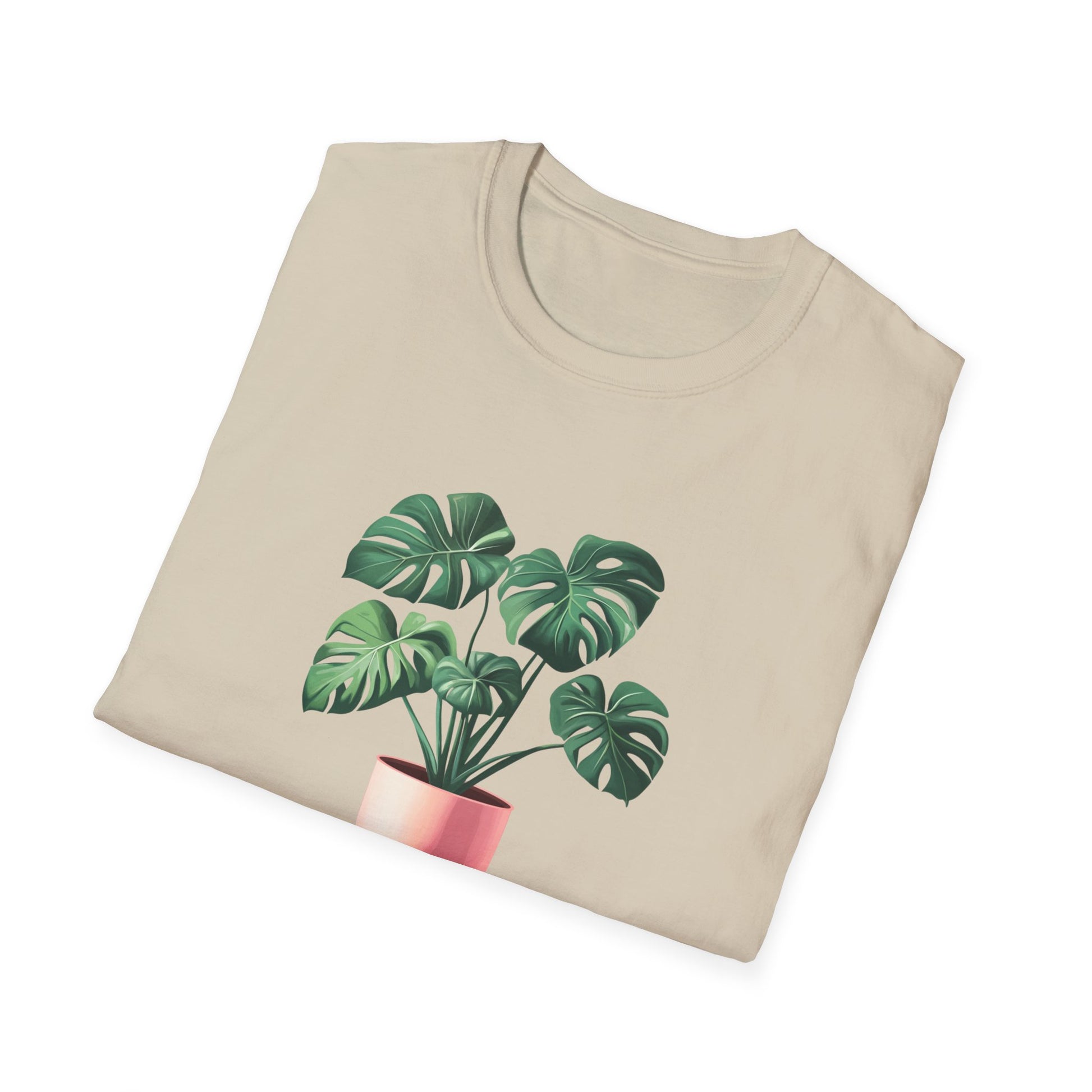 Monstera deliciosa t-shirt featuring a vibrant plant graphic on a light beige background