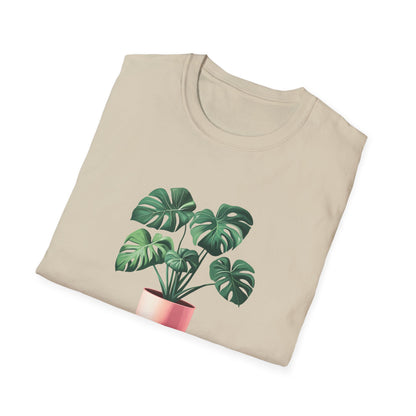 Monstera deliciosa t-shirt featuring a vibrant plant graphic on a light beige background