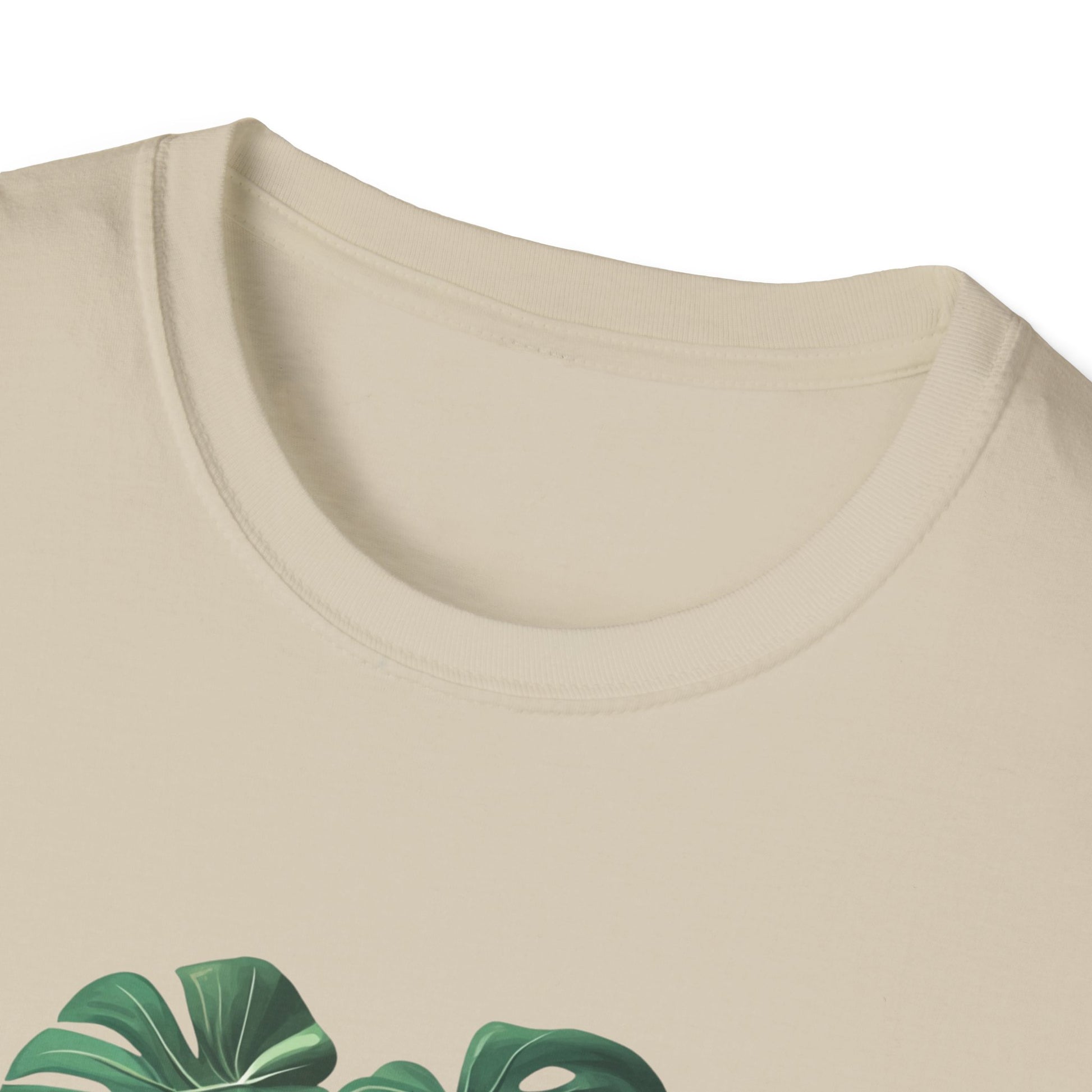 Monstera deliciosa t-shirt featuring a stylish plant print on a soft, beige fabric