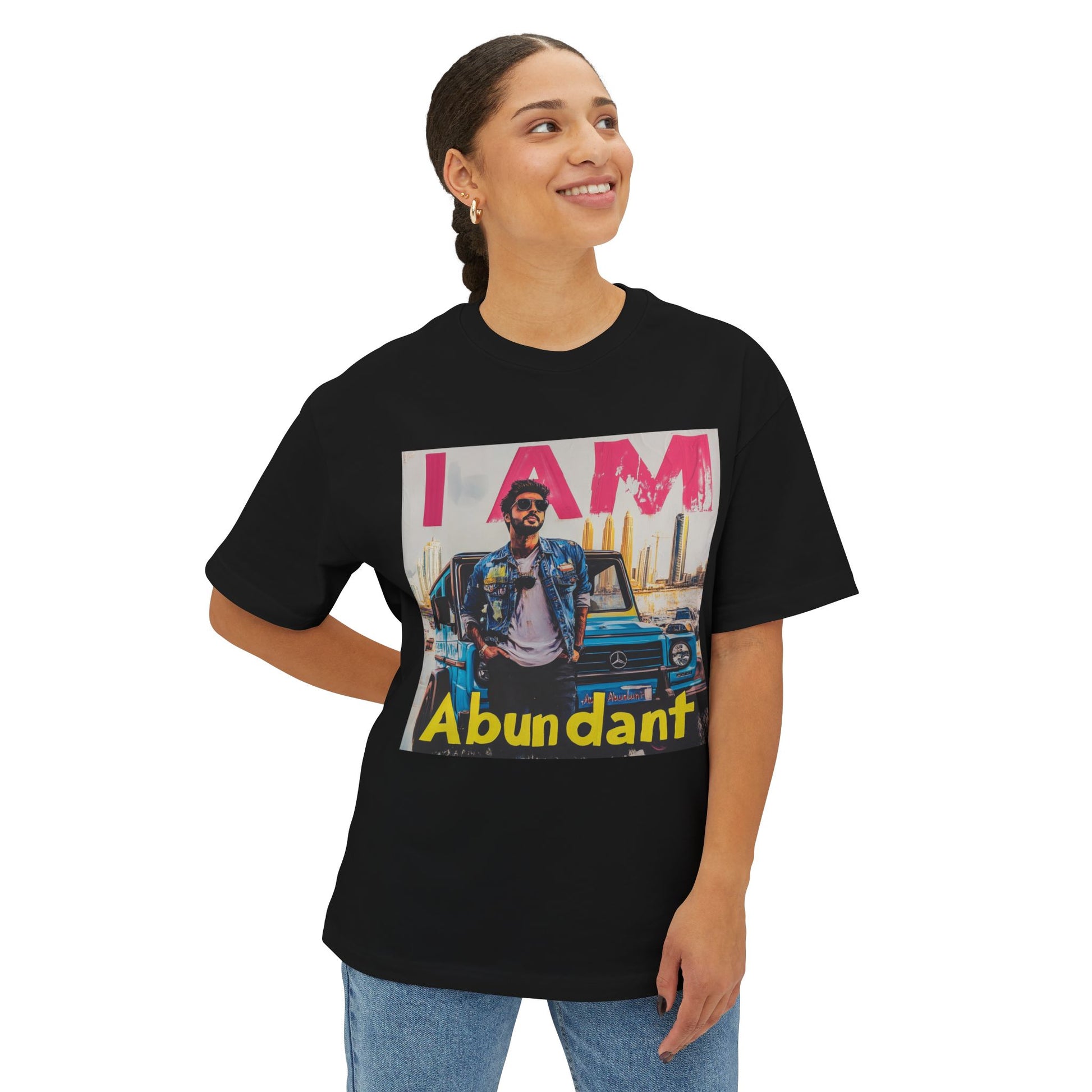 Model wearing a black abundant vibe oversized tee featuring colorful graphic design and relaxed fit