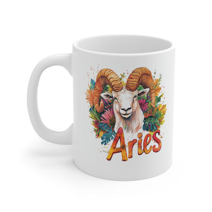 White ceramic aries zodiac mug with colorful ram illustration floral background and Aries script text