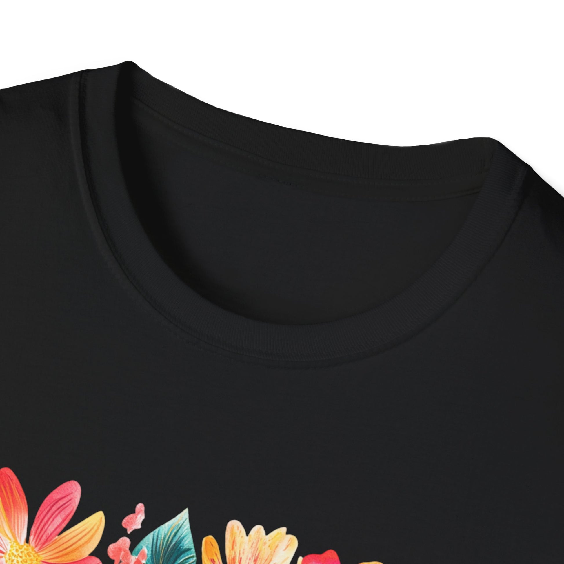 Close-up of a black child of God t-shirt featuring vibrant floral designs on the neckline