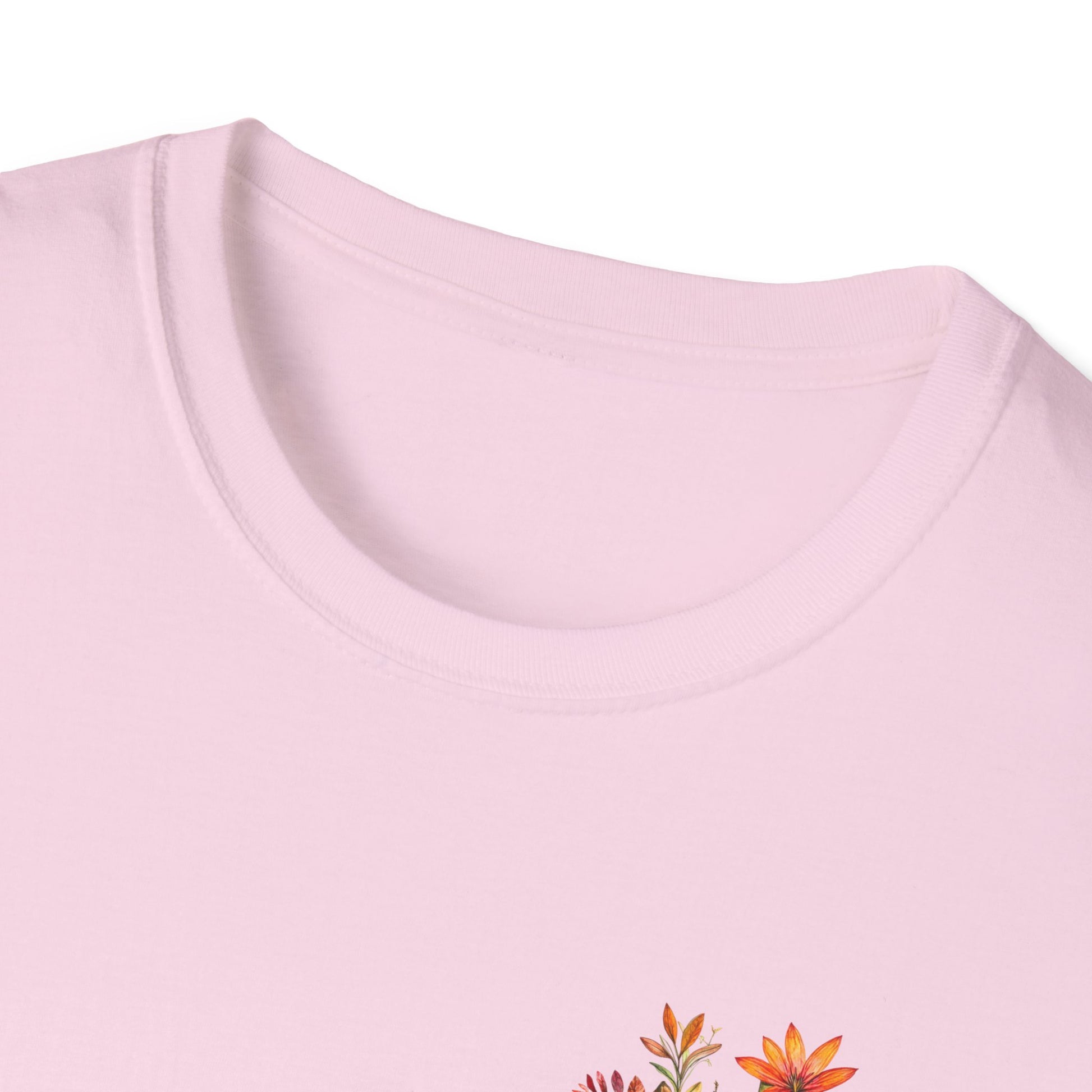 Light pink floral cross t-shirt featuring colorful floral designs on the chest