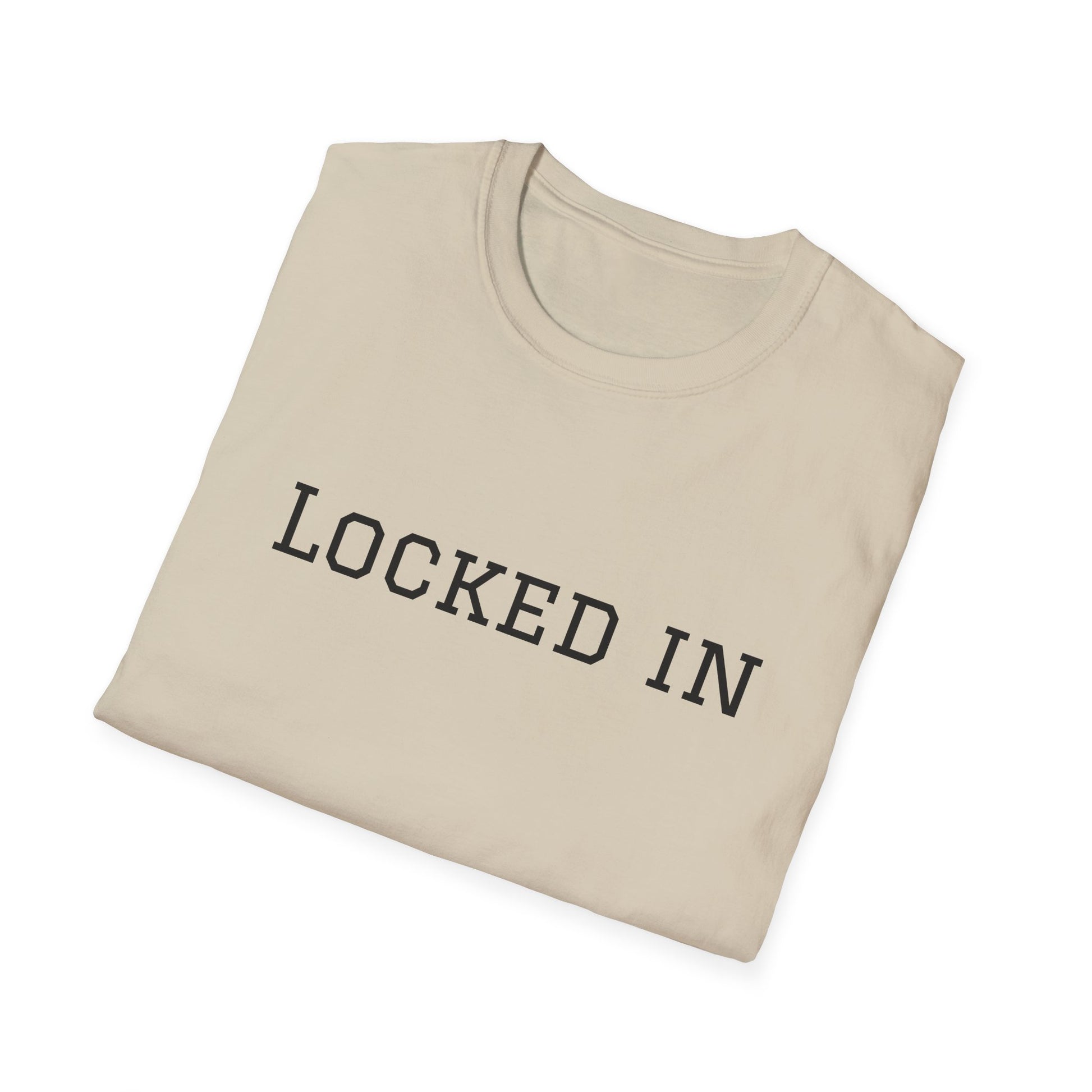 Beige folded crewneck Printify t shirt with black LOCKED IN varsity lettering locked in t shirt motivational