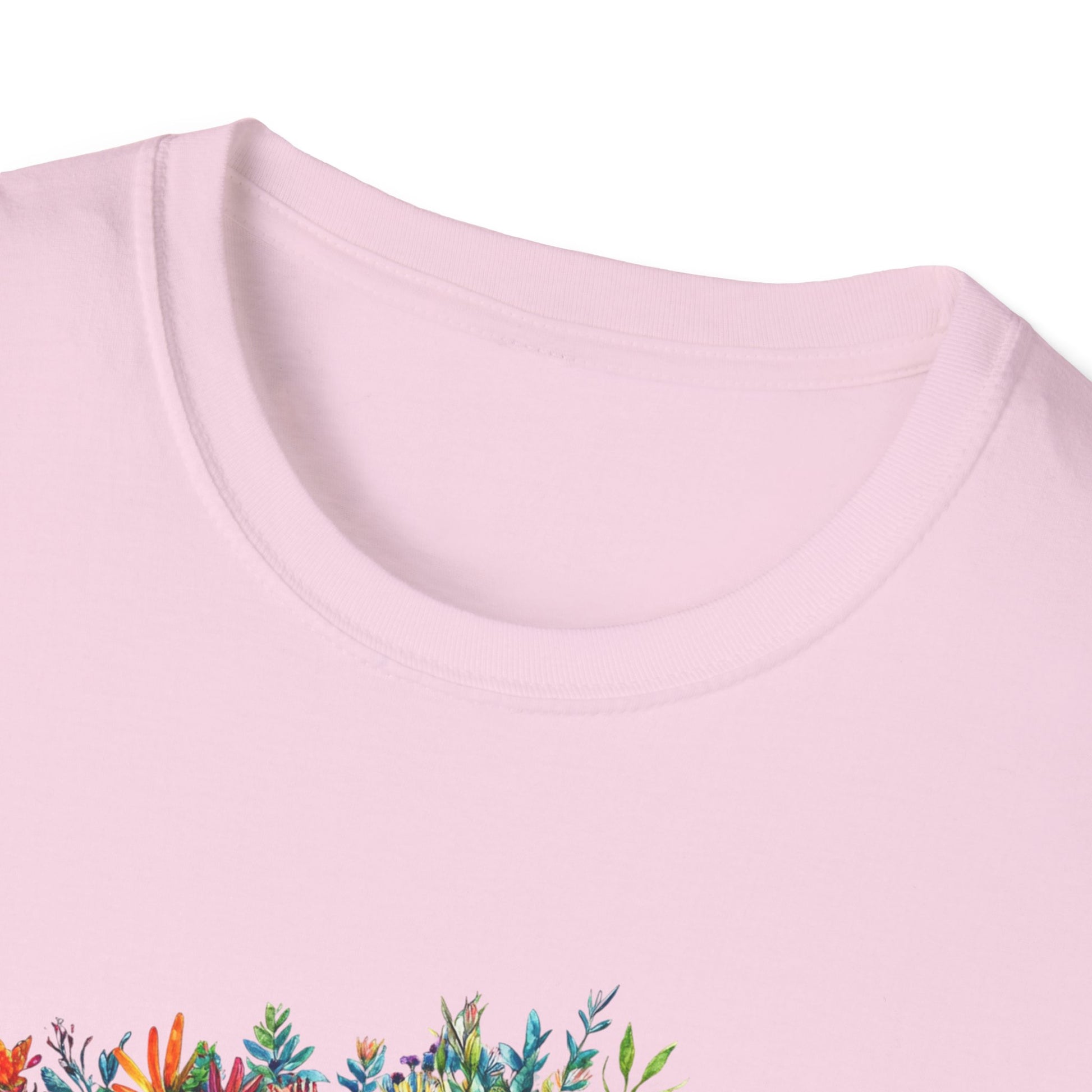 Light pink skoolie bus t-shirt featuring a colorful floral design on the front