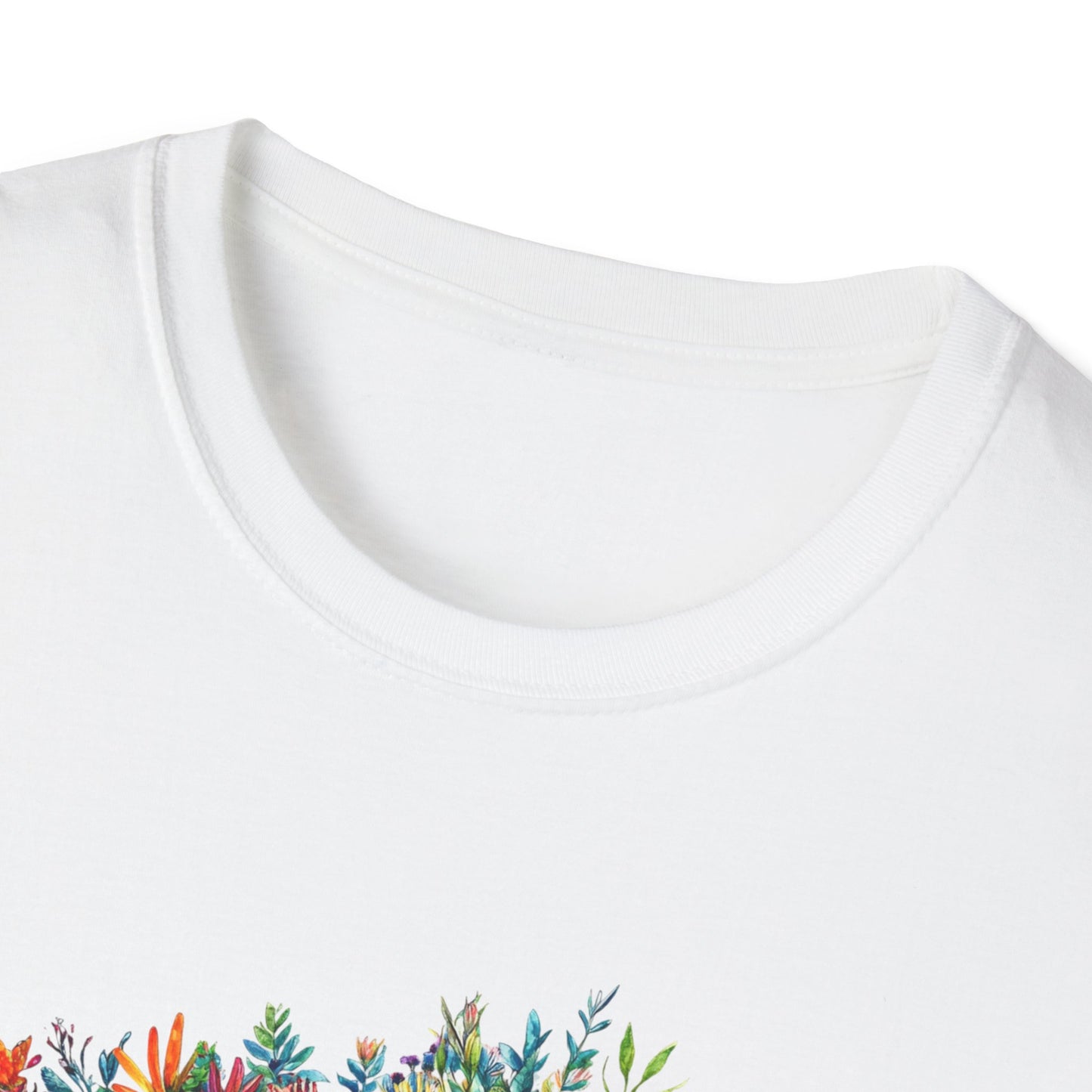 Close-up of a white skoolie bus t-shirt featuring vibrant floral designs on the front